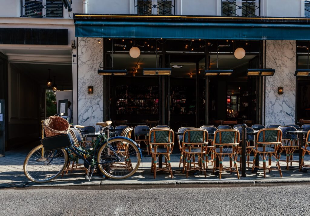 Cafe in Paris. The cafes of Paris often have a nice terrace outside for people watching. Sometimes a coffee on the terrace can cost a bit more than one taken at the bar. This is a standard part of Parisian culture.